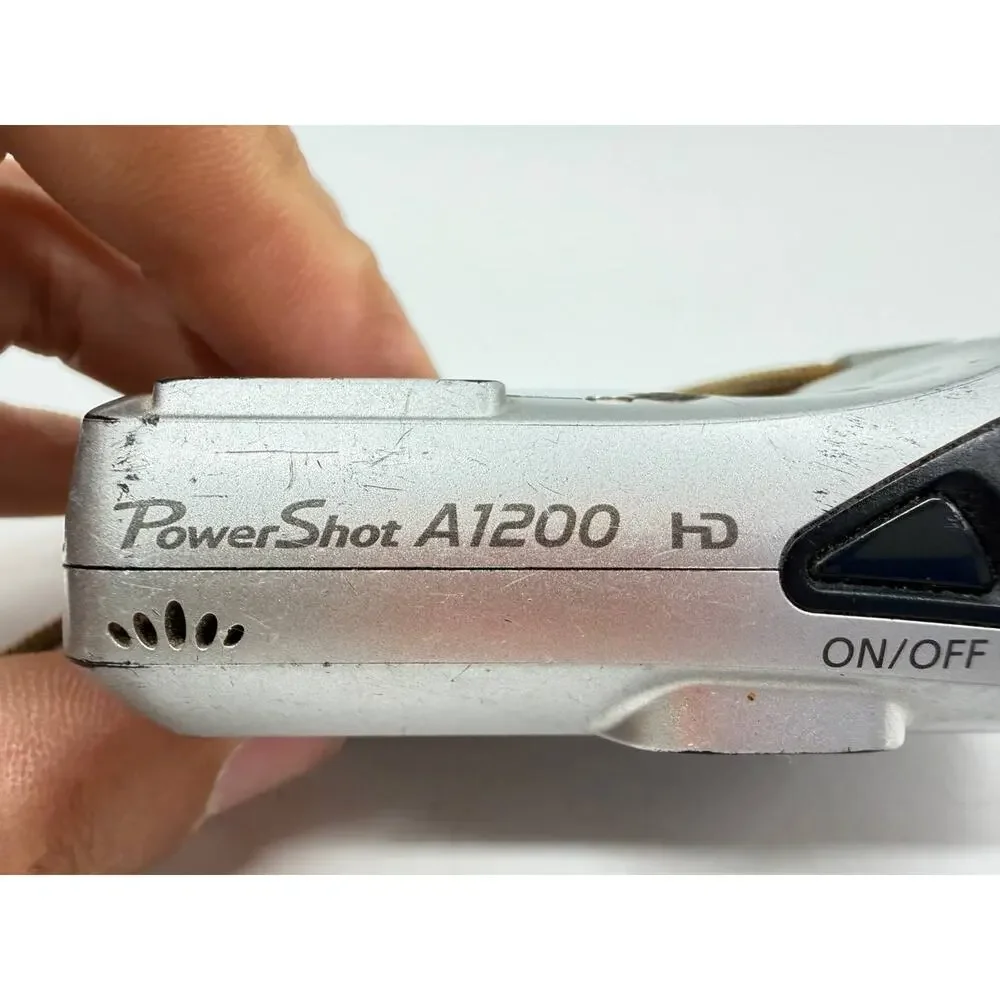 Canon PowerShot A1200 12.1MP Digital Camera Silver AS-IS Broken Battery Door